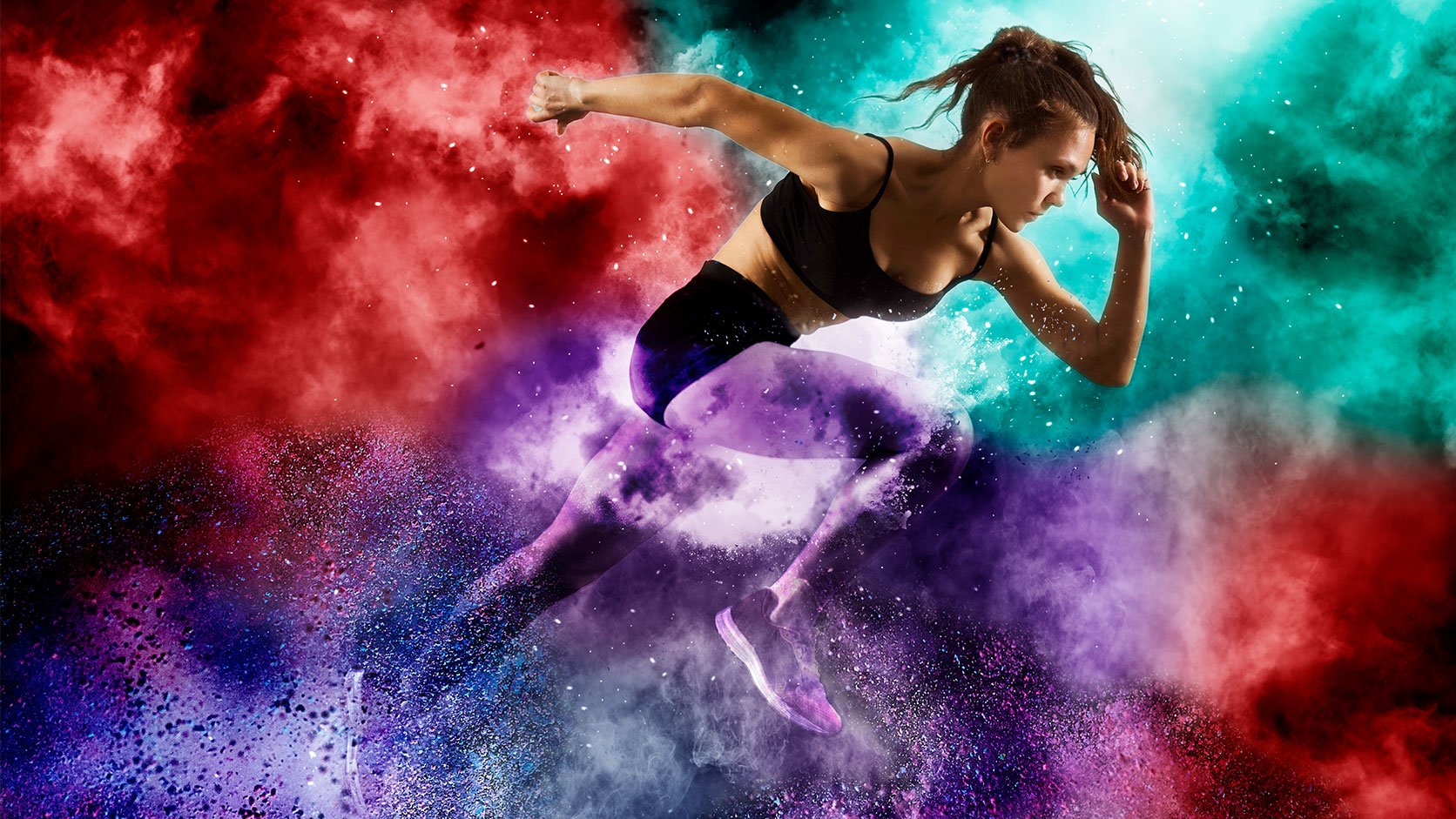 Woman runner with colored smoke around her